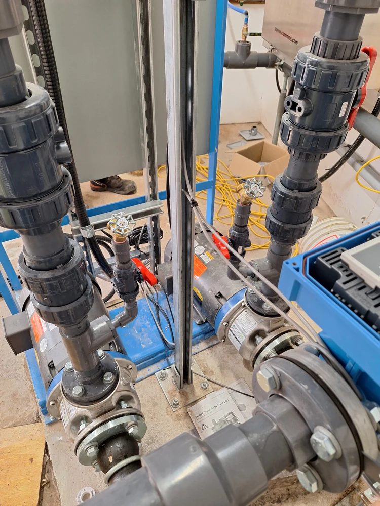 Water treatment pumps and associated piping inside a facility